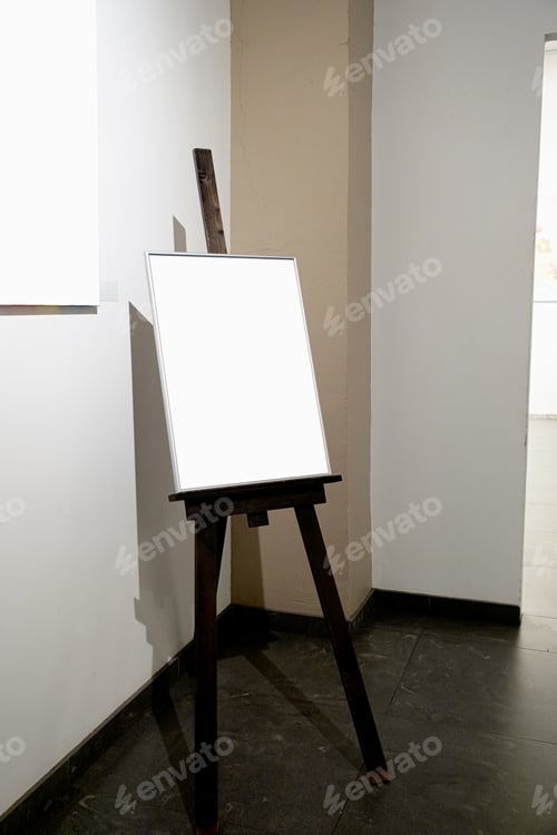 Preview: Blank picture frames on grey wall with glowing lamp, mock up
