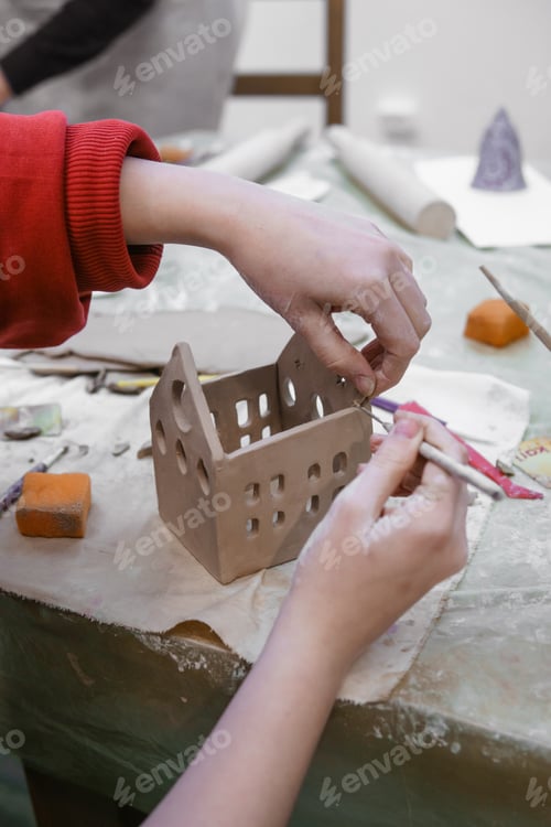 Preview: Women's hands knead clay, drawing elements of the product. Production of ceramic products