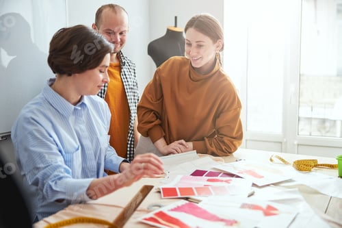 Preview: Designers consulting their coworker with about the color