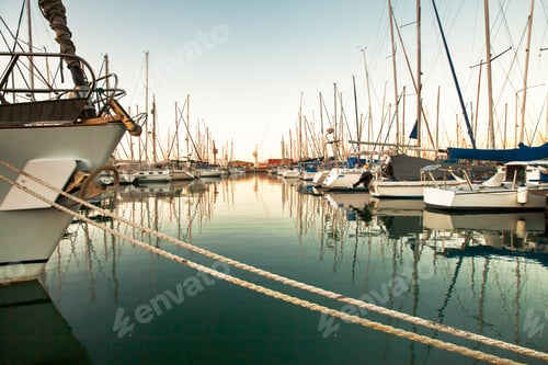 Preview: Safe harbour in a stormy world. A photo of a harbor with anchored ships.