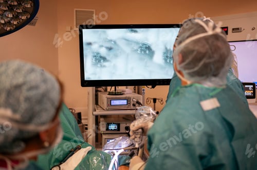 Preview: Team of surgeons operating in the hospital. Healthcare concept