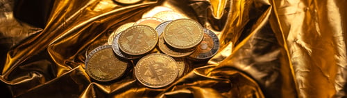 Preview: Cryptocurrency coin and bitcoin on golden background