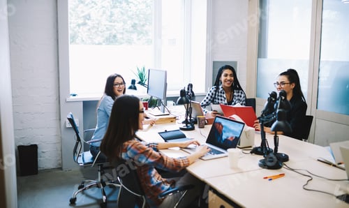 Preview: Happy colleagues communicating having break at work