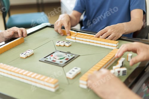 Preview: Elderly people playing mahjong in the recreation room of a long-term care facility