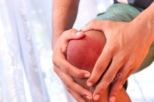 Preview: Close up on man suffering knee joint pain