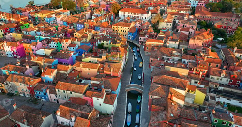 Preview: Aerial view of Burano colorful houses, along the Fondamenta embankment, Italy