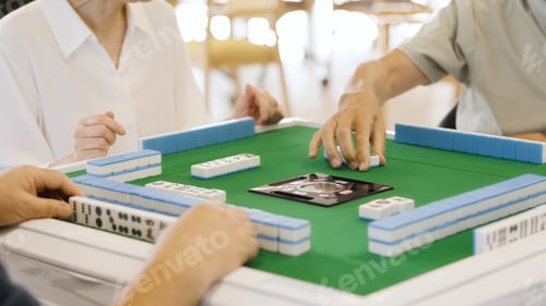 Preview: Asian elderly people playing mahjong in a care home