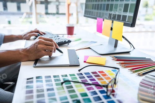 Preview: Two colleague creative graphic designer working on color selection and color swatches