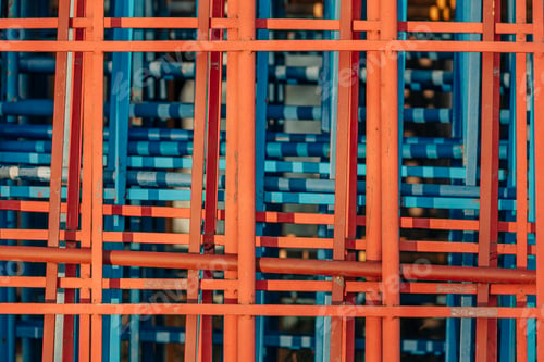 Preview: Piles of bed headboards in various colors, including red and blue, are stacked on top of one another