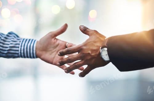 Preview: Closeup shot of two unrecognizable businesspeople shaking hands in an office