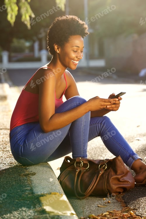 Preview: African lady woman using mobile phone