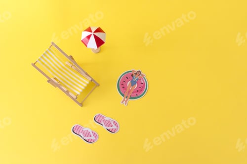 Preview: beach chair, umbrella, slippers and a woman relaxing on swimming ring on a yellow background