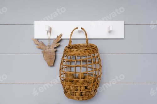 Preview: Wicker Basket Hanging on Wall with Wood Decoration