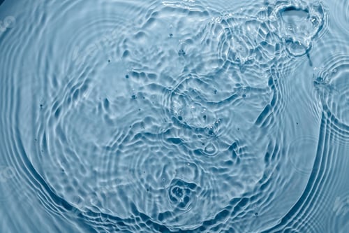 Preview: Blue water texture, blue pure water surface with waves and ripples. Flat lay, copy space
