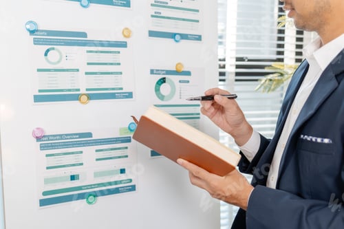 Preview: A professional businessman presenting financial analysis on charts