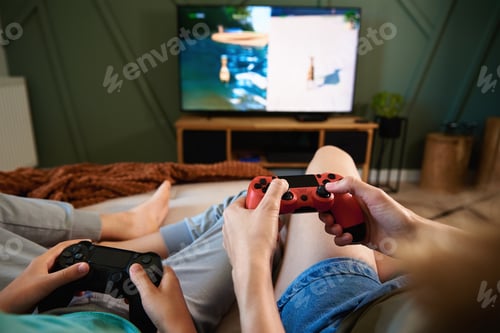 Preview: Boy and man playing video game at home