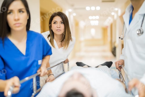 Preview: Transporting patient in a hospital hallway