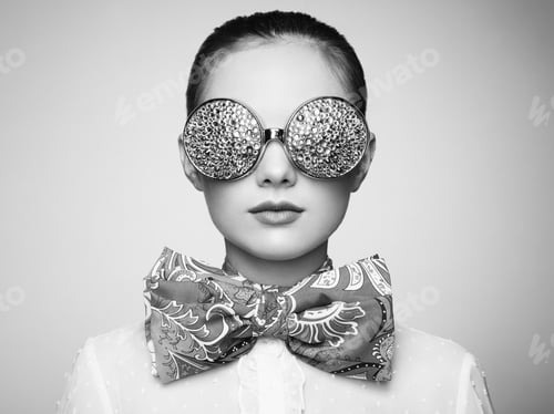 Preview: Portrait of beautiful young woman with colored glasses