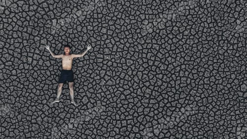 Preview: Boys sleep on dry land with dry and cracked soil, global warming