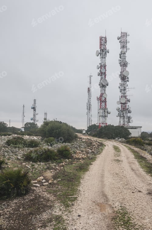 Preview: Vertical shot of communication antennas on mount Subasio