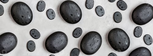 Spa Rocks with Water Droplets on Gray Surface