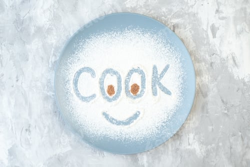Preview: top view white flour making cook writing inside plate on white background cake bake egg color cook