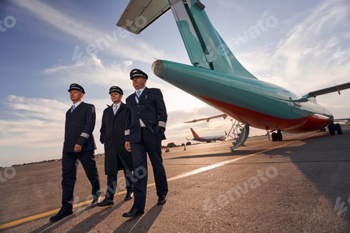 Preview: Three plane captains making a step forward from airplane