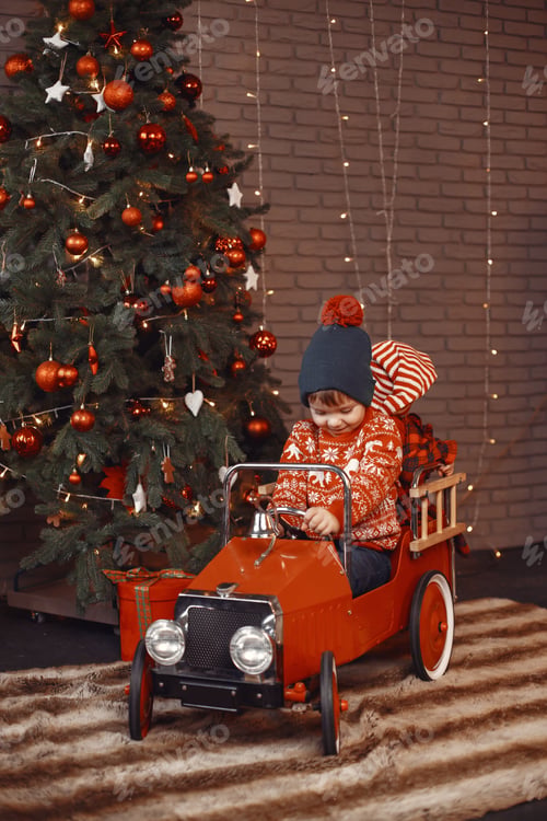 Preview: Cutte little boy at home near christmas decorations