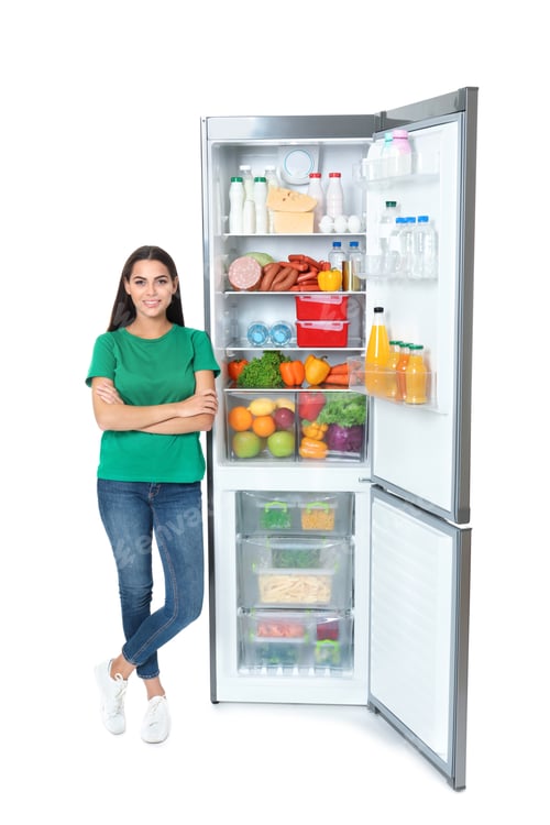 Preview: Young woman near open refrigerator on white background