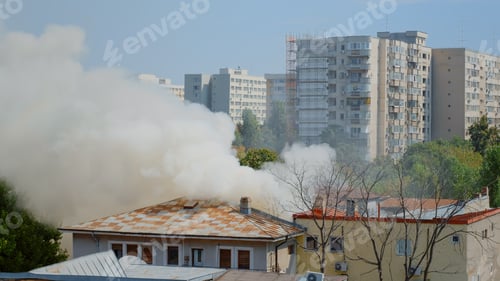 Preview: View of firefighters using water to extinguish fire from burning house