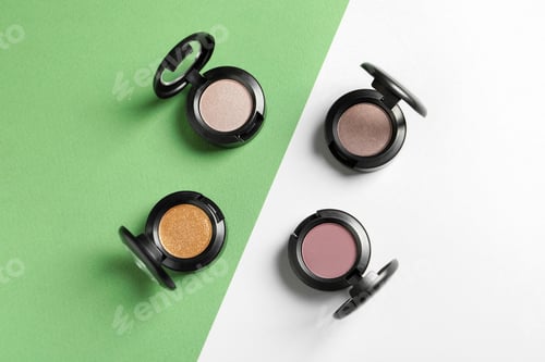 Preview: Flat lay composition with different eye shadows on color background