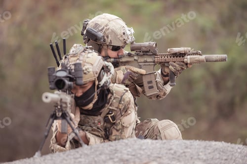 Preview: Soldiers in camouflage military uniforms carrying weapons Reconnaissance missions in rugged mountain