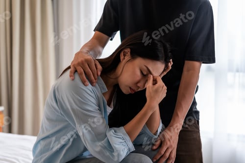 Preview: Young man comforting and supporting a sad woman who is in serious trouble at home