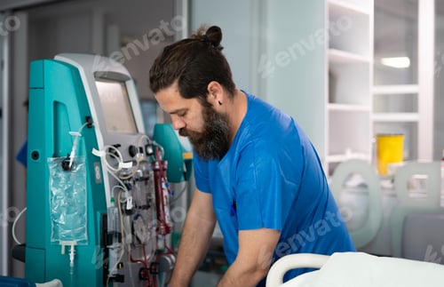 Preview: Doctor setting up dialysis machine in hospital room