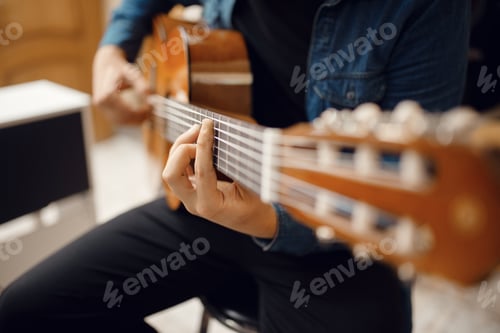 Preview: Guitarist trying to play on guitar in music store