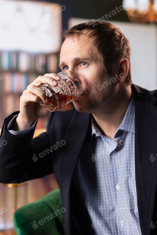 Preview: Classy gentleman sipping on scotch whiskey at the upper class country club