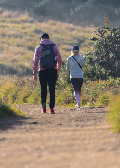Preview: Couple trekking in the Horton plains national park in the morning.