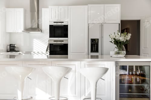Modern white kitchen interior design with breakfast bar
