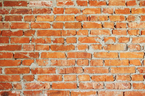 Preview: Bricks wall masonry with cement. Process of house building and building materials. Brick wallpaper