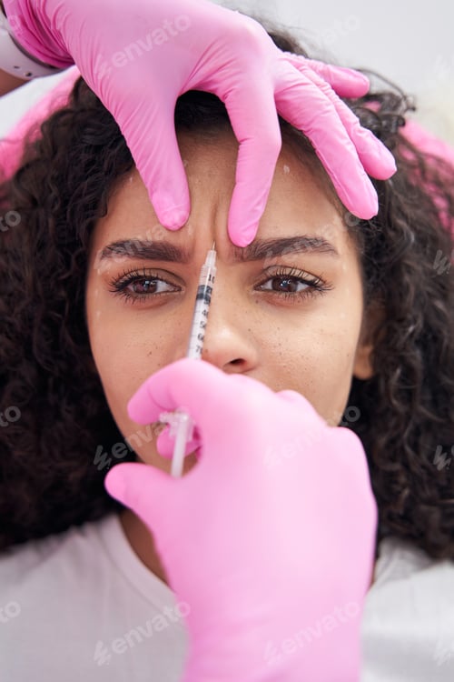 Preview: Beautician performs the procedure for correcting the brow wrinkle female