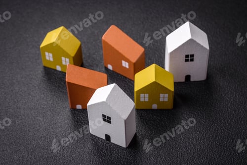 Colorful Miniature Toy Houses on a Dark Surface