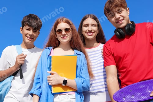 Preview: Group of teenagers walking together outdoors, low angle view