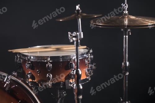 Preview: Close-up Drum set in a dark room against the backdrop of the spotlight.