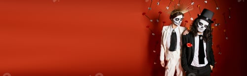 Preview: elegant couple in dia de los muertos sugar skull makeup posing on red backdrop with flowers, banner