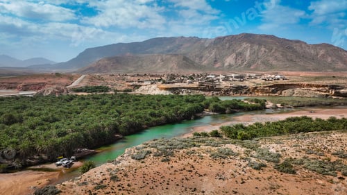 Preview: Socotra landscape showcasing lush vegetation and mountainous terrain under a bright sky