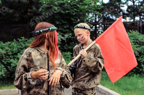 Preview: Children playing in lasertag shooting game in open air. Weapon in the hands of people. N