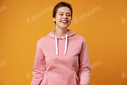 Preview: Studio portrait of young smiling woman with short hair