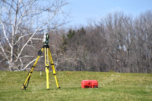 Preview: Surveyor equiptment tripod with theodolite set up to do mark property lines