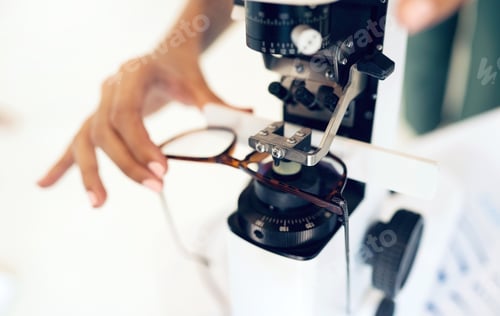Preview: Lens, glasses or hand with tool for eye care, vision and focus with closeup at optometrist or optom