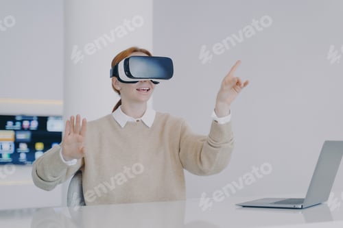 Preview: Young european woman entrepreneur in VR headset. Concept of digital solutions in remote work.